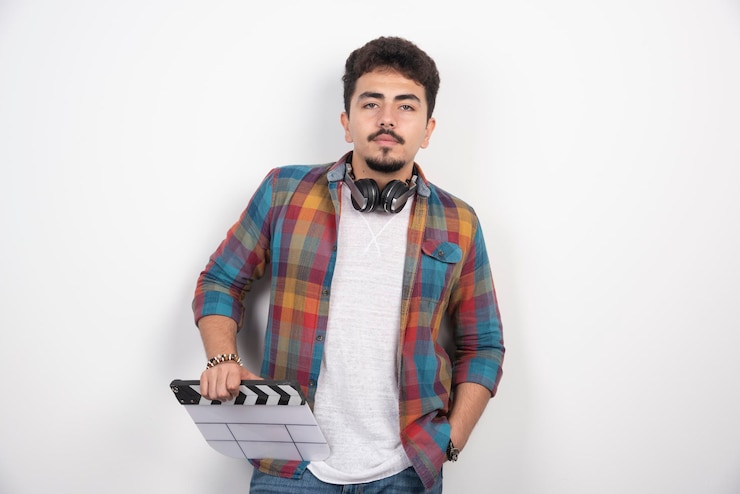 Filmmaker holding a blank white clapper board.